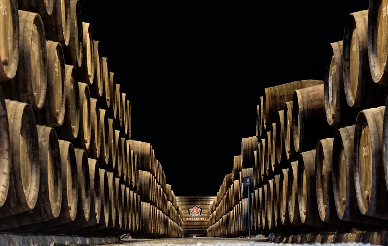 Rows of barrels inside Taylor’s port wine cellars in Vila Nova de Gaia